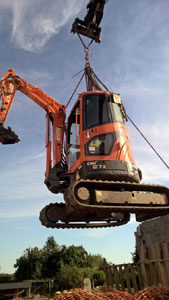 3 Ton Mini digger being hoisted on to a site